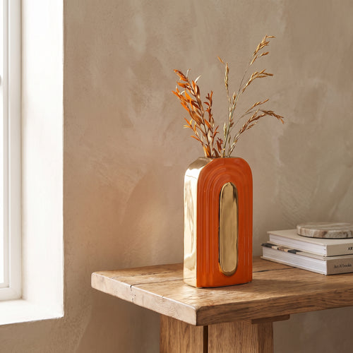 Arc Orange Ceramic Vase styled in a home setting