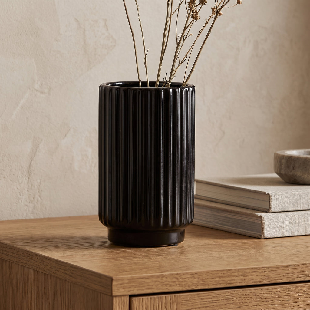 Fluted Black Ceramic Vase styled in a home setting
