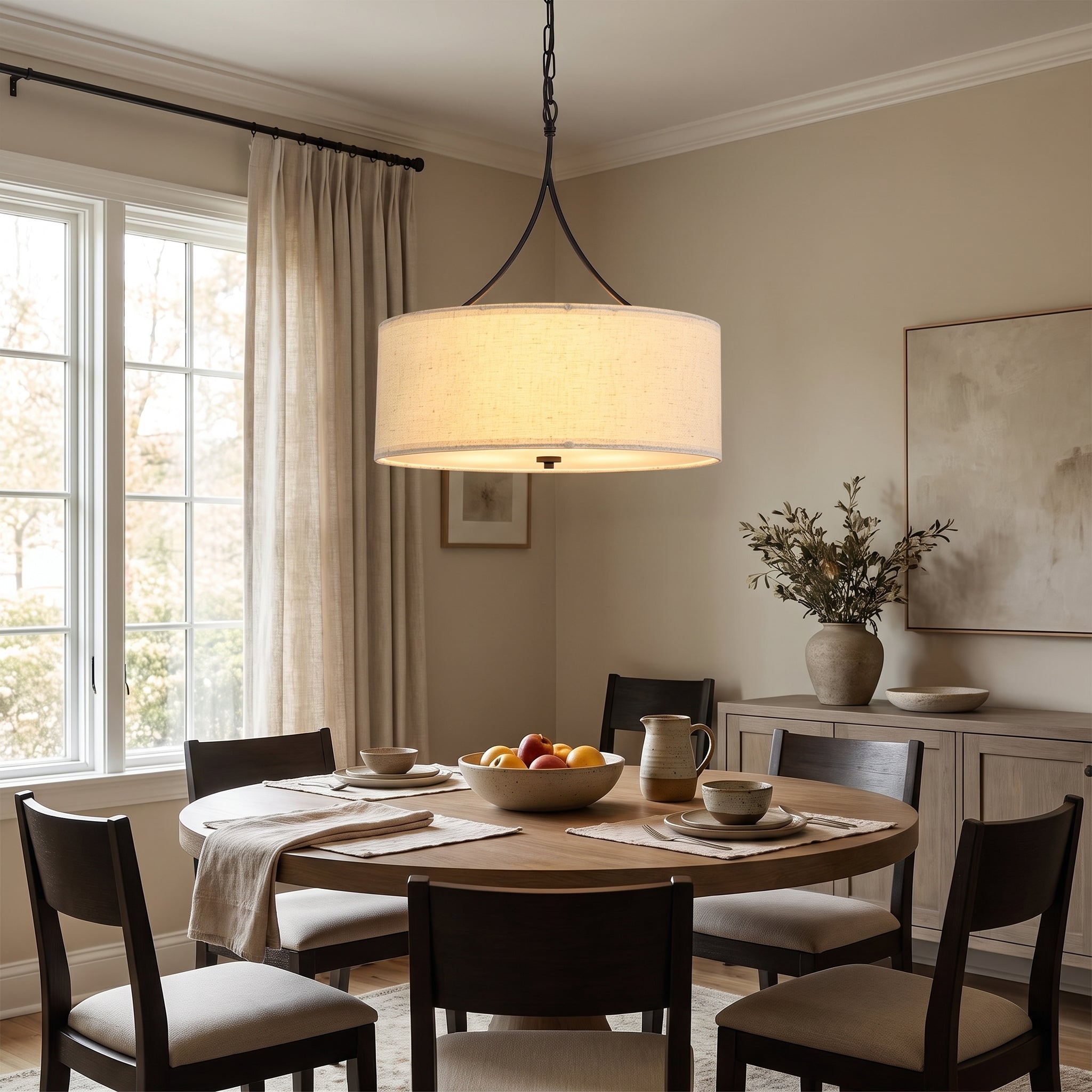 Linen Drum Three-Light Pendant styled in a home setting