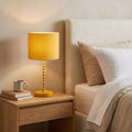Sereno Ochre Table Lamp styled in a home setting