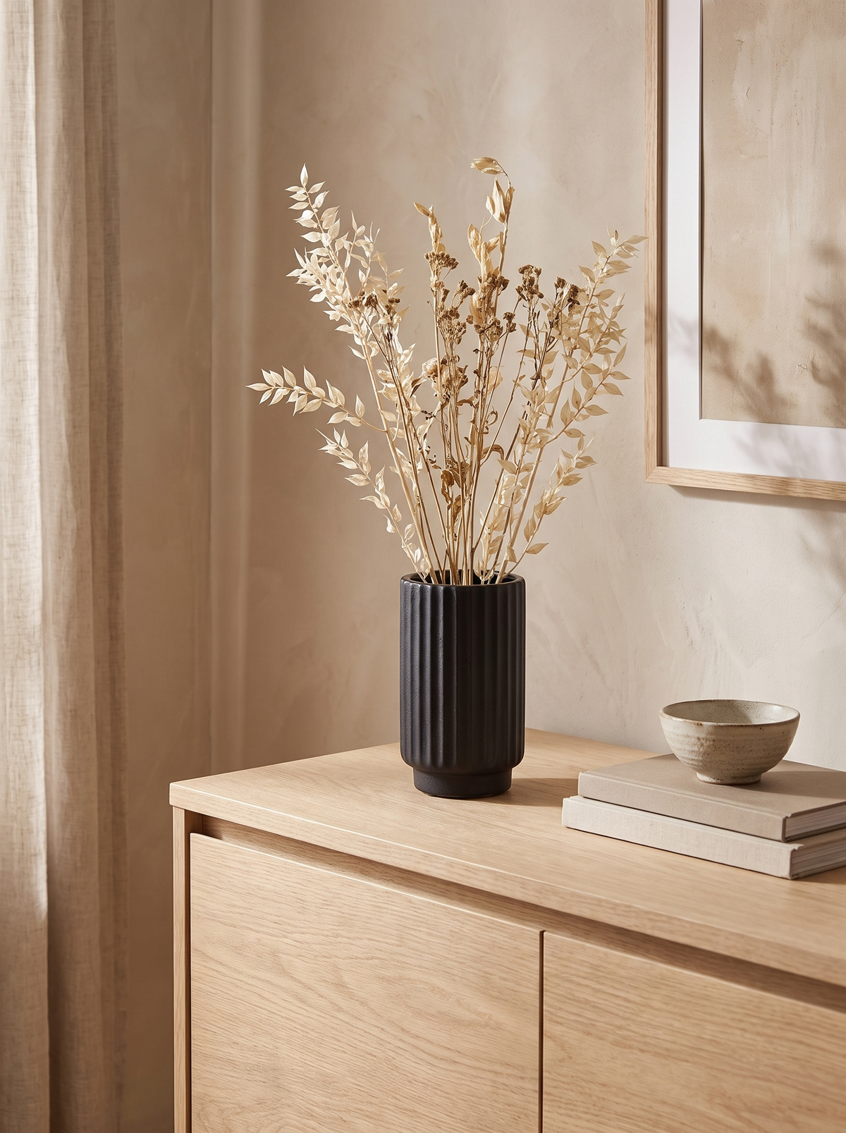 Fluted Black Ceramic Vase in a home setting — a dark note on a pale shelf