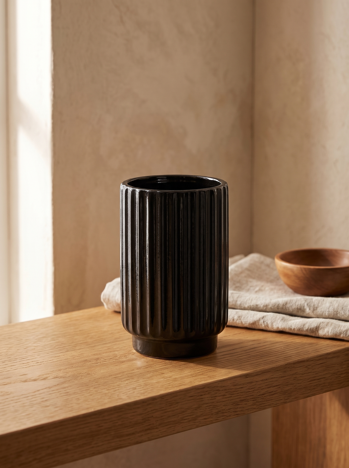 Fluted Black Ceramic Vase in a home setting — keep the arrangement simple