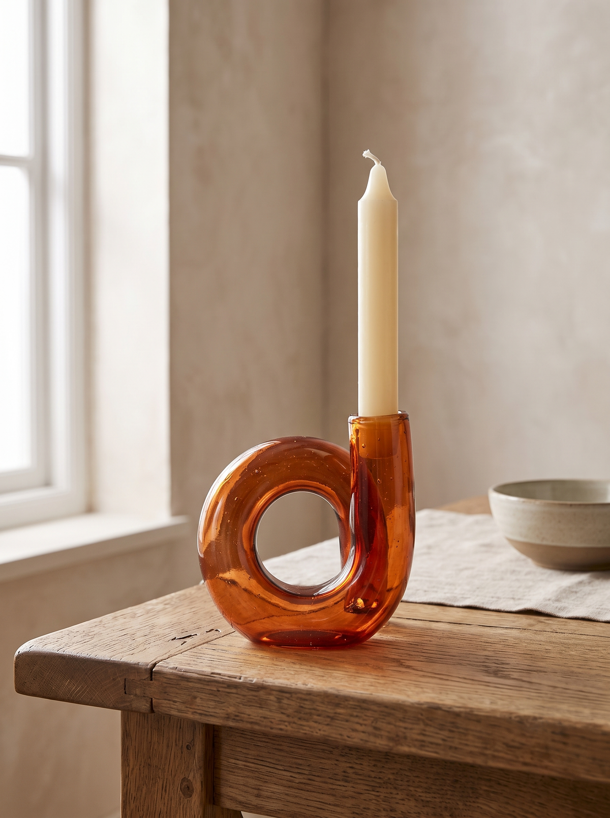 Loop Amber Glass Candle Holder in a home setting — light through the curve